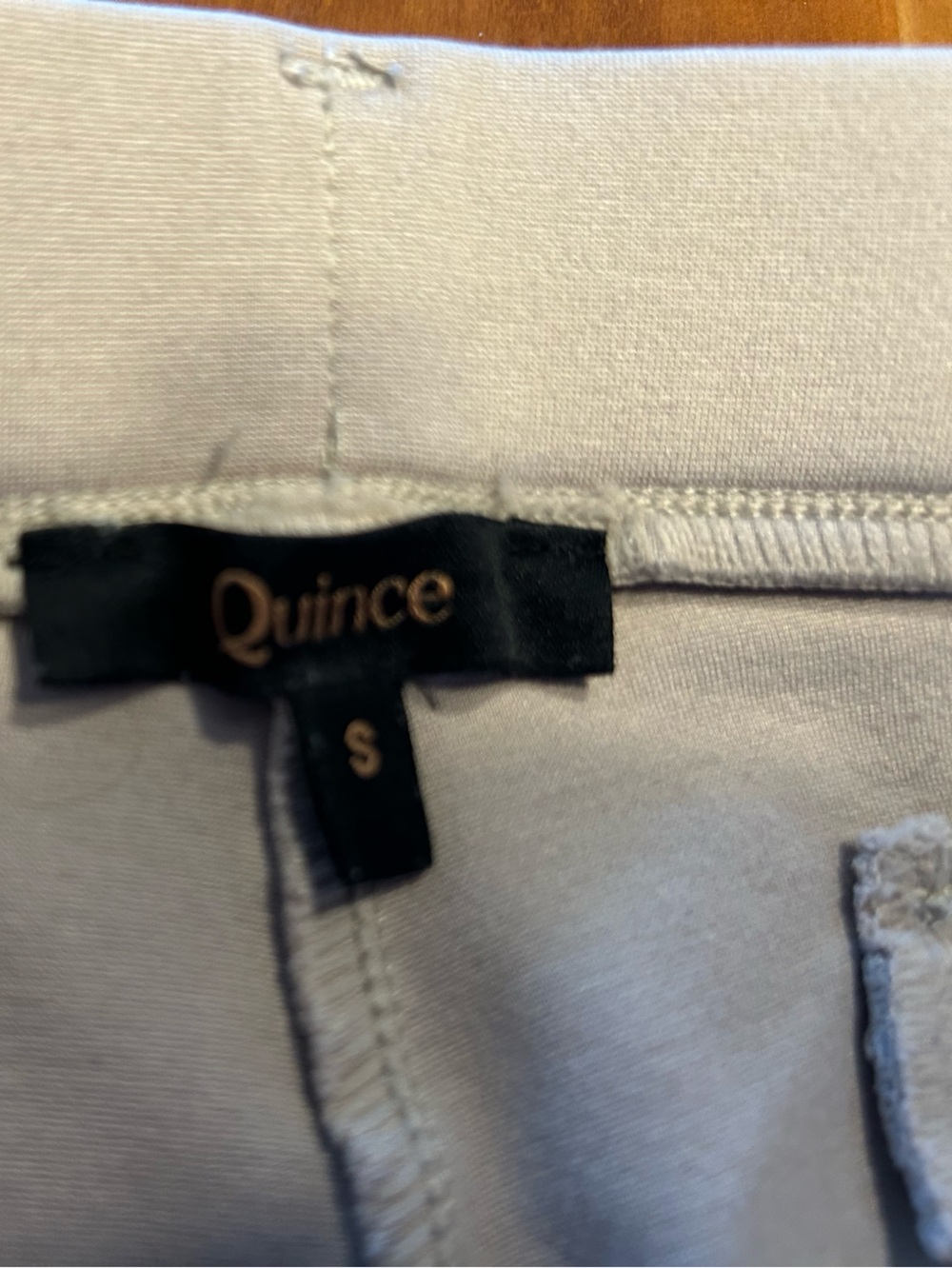 Quince fitted ankle length tan pants.